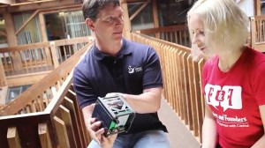 Tim DeBenedictis and Anna Vital with the SkyCube satellite