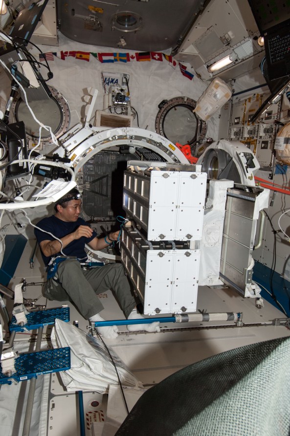Astronaut Koichi Wakata KC5ZTA prepares NanoRacks CubeSat Deployers