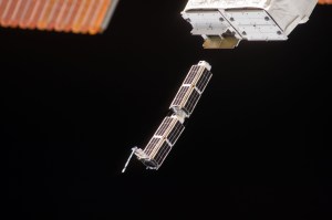 Close-up of Planet Labs Dove CubeSats leaving NanoRacks deployer February 11, 2014