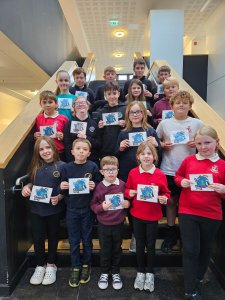 Young questioners with their practice cue cards at Wick High School